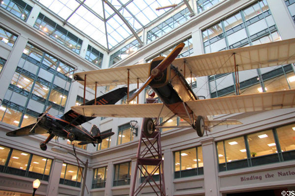 Small planes which once flew mail suspended in atrium of National Postal Museum. Washington, DC.