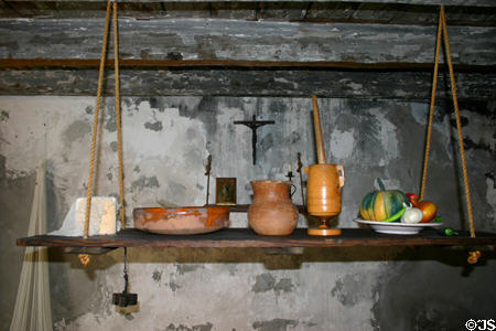 Hanging shelf with Spanish colonial-style pottery in The Oldest House. St Augustine, FL.