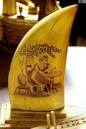 Whales-tooth scrimshaw etched with woman reading at Lightner Museum. St Augustine, FL.
