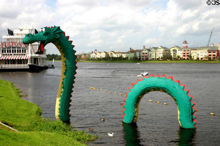 Lego block dragon in lake beside paddle wheel restaurant at Downtown Disney. Disney World, FL.