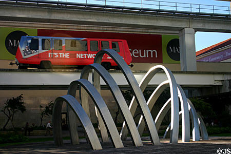Arched sculpture Rhythm of the Train (1988) by Joan Lehman on Metromover right-of-way. Miami, FL.