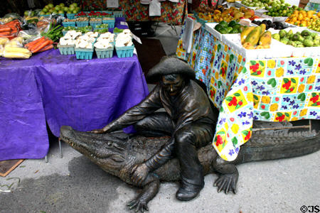 Sculptures of alligator wrestler by farmers market. Orlando, FL.