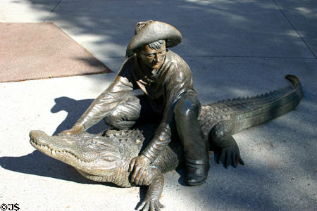 Sculpture of Alligator & wrangler by Craig T. Ustler. Orlando, FL.