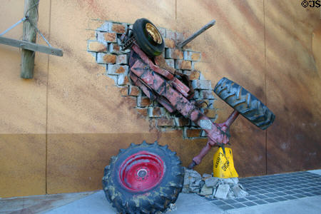 Twister™© attraction with car embedded in wall at Universal Studios. Orlando, FL.