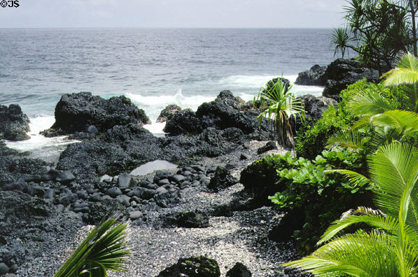 Waves crash against rocks at National Tropical Garden at Kahanu. Maui, HI.