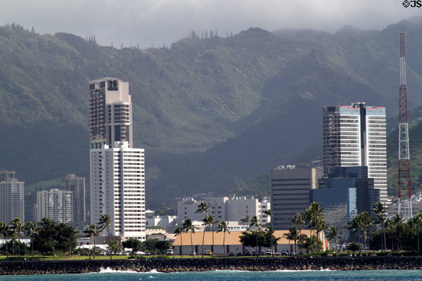 Honolulu skyline between Keola Lai condominium & Royal Capitol Plaza from sea. Honolulu, HI.