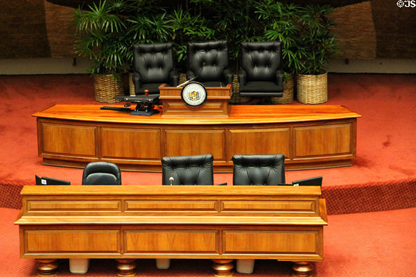 Acacia Koa wood desks of Speaker in House of Representatives chamber of Hawaii State Capitol. Honolulu, HI.