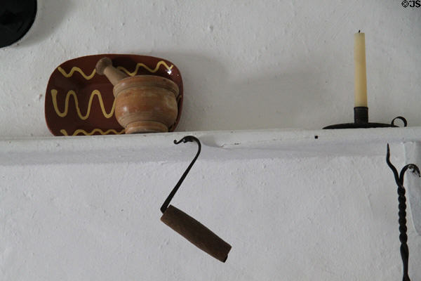 Implements on kitchen mantle in Oldest Frame House of Mission House Museum. Honolulu, HI.