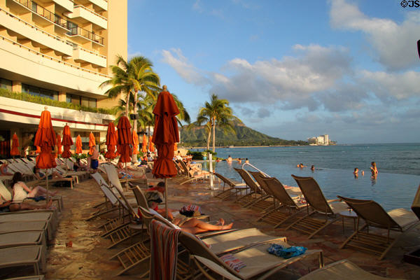 Pool deck over ocean of Sheraton Waikiki Hotel. Waikiki, HI.