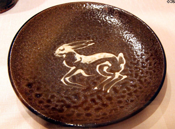 Japanese glazed stoneware tamba ware plate with rabbit (1953-4) at Honolulu Academy of Arts. Honolulu, HI.