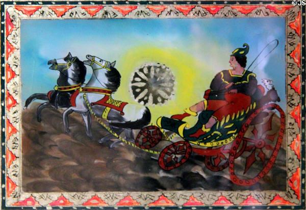 Reverse glass painting of chariot on banjo wall clock at Dodge House. Council Bluffs, IA.