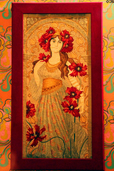 Art Nouveau embroidery of young woman with red flowers at Dodge House. Council Bluffs, IA.