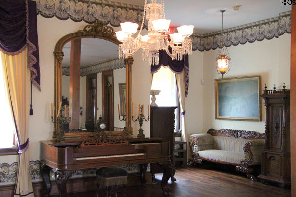 Top-floor ballroom with square piano & mirror at Dodge House. Council Bluffs, IA.