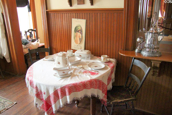 Kitchen eating table with hot water tilting pitcher at Dodge House. Council Bluffs, IA.