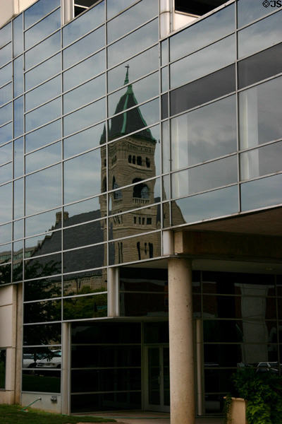 St Ambrose Cathedral reflected in Convention Center. Des Moines, IA.