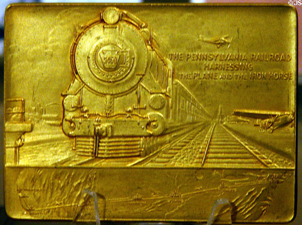 Brass medal to commemorate first combination train-air passenger service (July 7, 1929) at Hoover Museum. West Branch, IA.