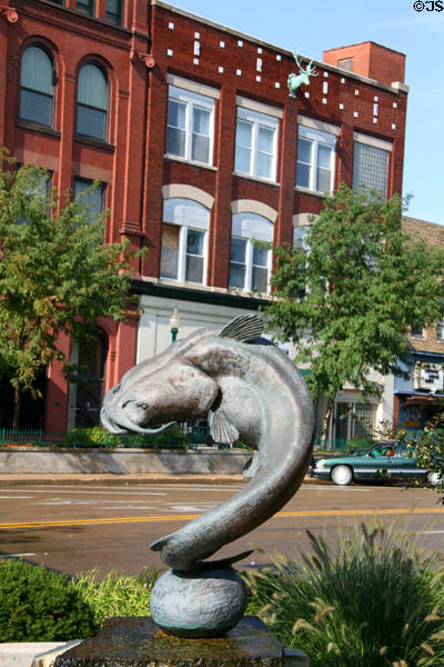 Sculpture of swimming catfish & building with deer head (5th Ave.). Clinton, IA.