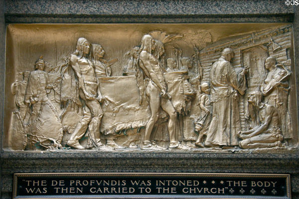 Bronze relief of a Catholic funeral with native Americans 