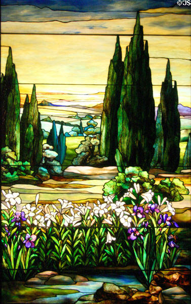 Stained glass window (c1915) of landscape with yellow sky by Agnes E. Northrop & Tiffany Studios at Stained Glass Museum. Chicago, IL.