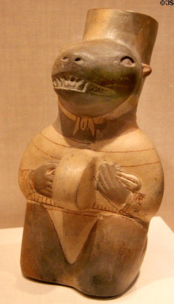 Moche ceramic vessel in form of seal impersonator playing a drum (100 BCE-500 CE) from North Coast, Peru at Art Institute of Chicago. Chicago, IL.