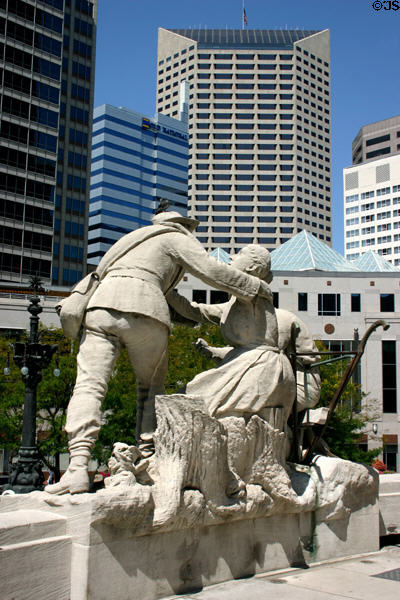 Returning plowman statue on War Memorial against modern buildings. Indianapolis, IN.