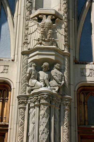 Stone eagle & bound men on Scottish Rite Cathedral. Indianapolis, IN.