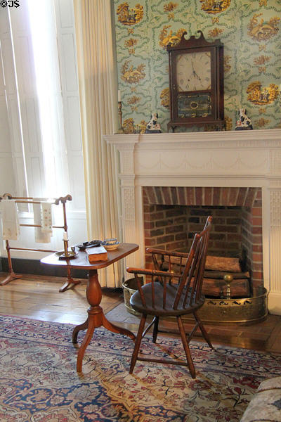 Bedroom fireplace with clock plus table & chair at Grouseland. Vincennes, IN.