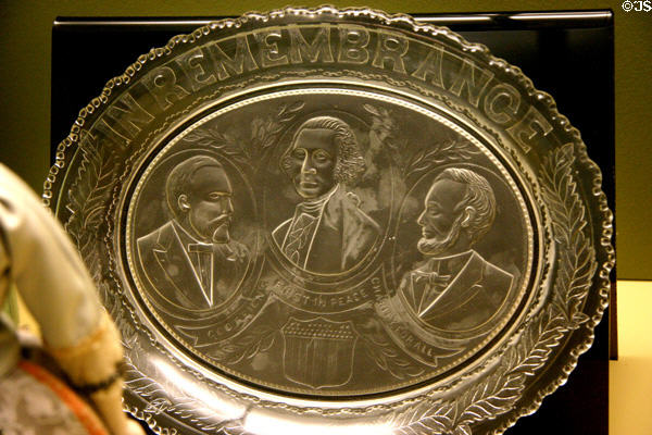 Pressed glass plate in remembrance of Presidents Washington, Lincoln & Grant at Eisenhower Museum. Abilene, KS.