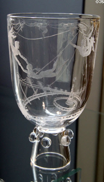 Engraved lead glass goblet in Aerialists pattern (c1953) by Bruce Moore of Steuben at Wichita Art Museum. Wichita, KS.