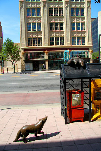 Sculpture of foxes forcing ducks to top of newspaper boxes. Wichita, KS.
