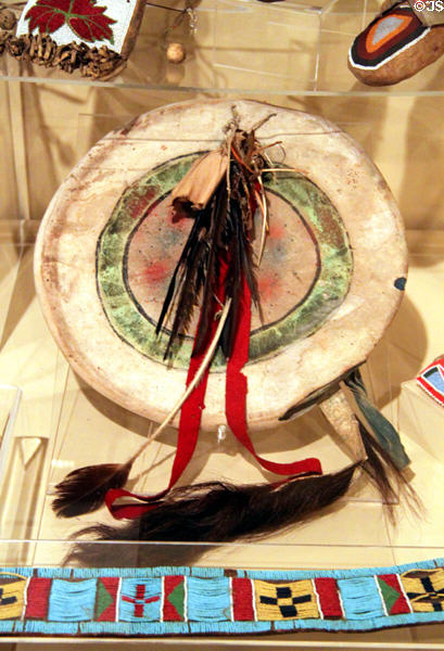 Plains Indian rawhide painted shield with feathers & buffalo tail (c1870) at Sedgwick County Historical Museum. Wichita, KS.
