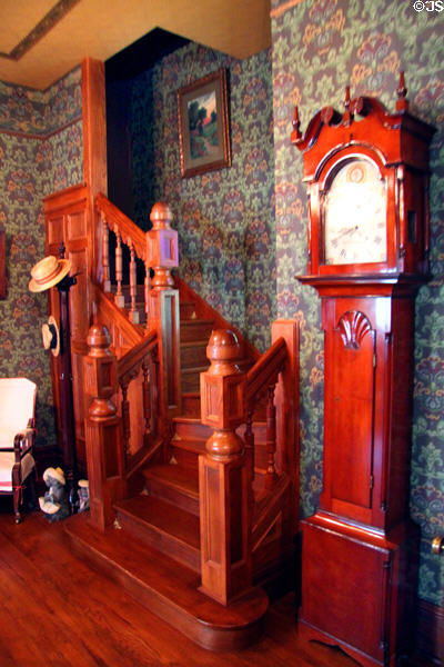 Reception room stairway & tall clock (c1813) by John Samuel Krause in recreated Wichita Cottage (c1890) at Sedgwick County Historical Museum. Wichita, KS.