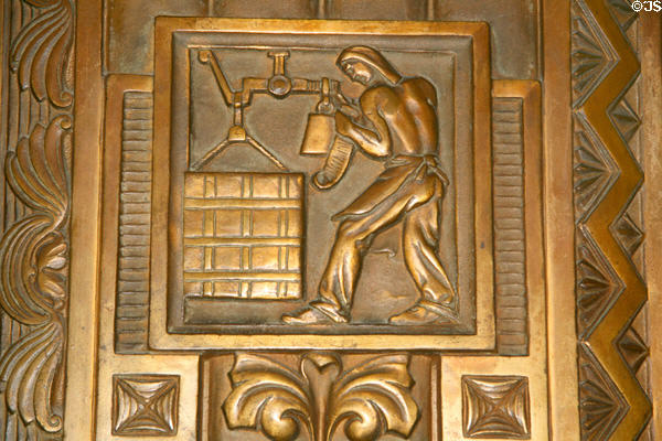 Bronze plaque of man weighing cotton bale in Memorial Hall of Louisiana State Capitol. Baton Rouge, LA.