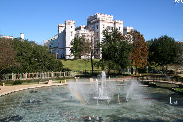 Old State Capitol over park fountains. Baton Rouge, LA.