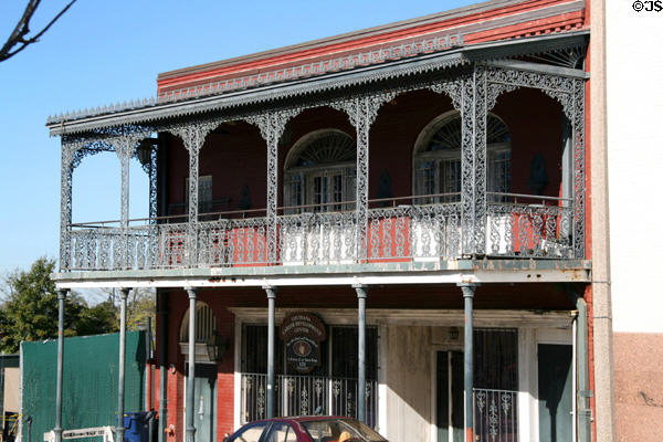 One of Baton Rouge's last remaining buildings with cast iron balconies (121 Convention St.). Baton Rouge, LA.
