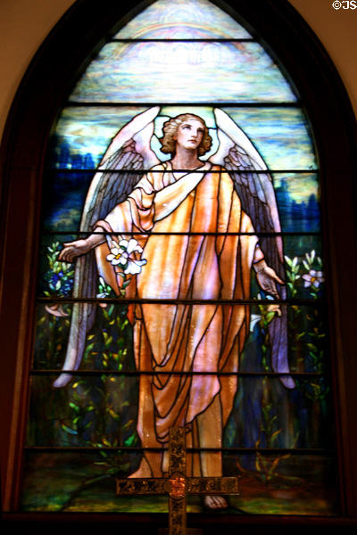 Tiffany stained glass window of angel with lilies in St. James Episcopal Church. Baton Rouge, LA.