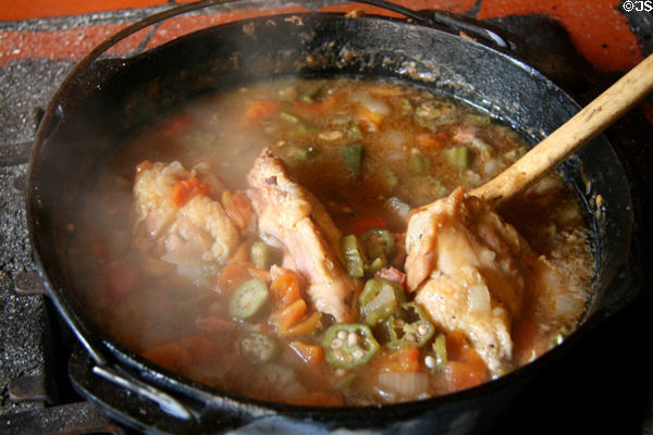 Gumbo with chicken & okra in iron pot at outdoor kitchen of Hermann Grima House. New Orleans, LA.