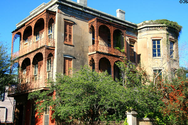 Corner mansion with elaborate ironwork at Esplanade Ave. & Bourbon St. New Orleans, LA.