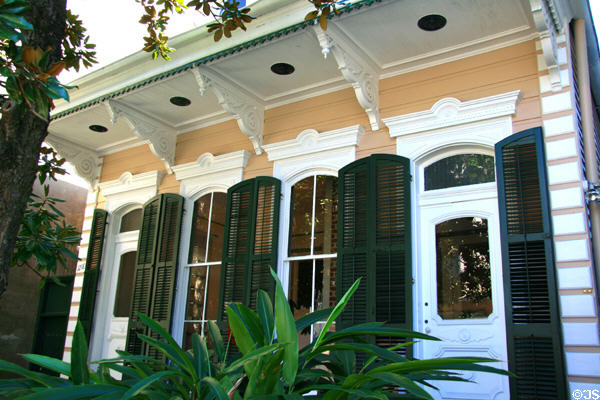 Double shotgun house with green shutters (1218 Bourbon St.). New Orleans, LA.