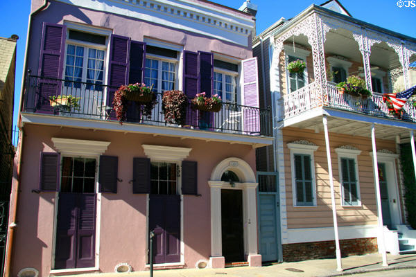 Purple house (1127 Bourbon St.) & house with balcony over sidewalk (1129 Bourbon St.). New Orleans, LA.