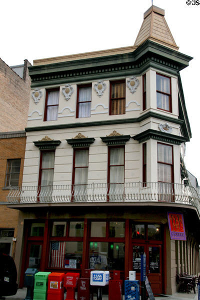 Corner building with square tower (644 Camp St.). New Orleans, LA.