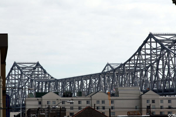 Crescent City Connection Bridge seen above New Orleans buildings. New Orleans, LA.