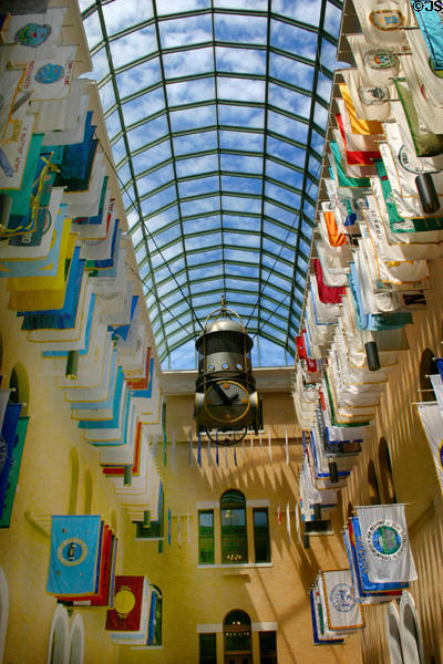 New Atrium between wings of Massachusetts State House with flags of the state's cities. Boston, MA.