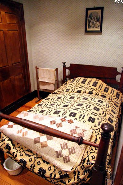 Boarding house mistress bedroom bed with quilt at Boott Cotton Mills Boarding House. Lowell, MA.