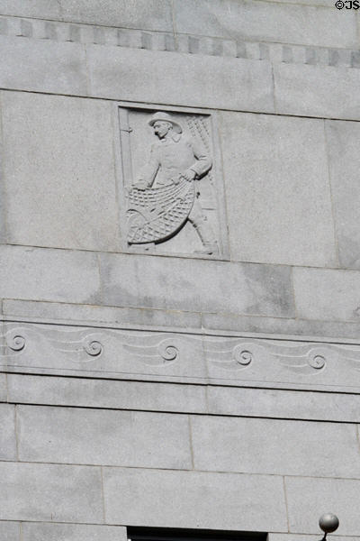 Carved fisherman relief on library annex of New Bedford Whaling Museum. New Bedford, MA.