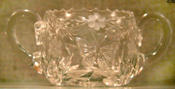 Cut glass sugar bowl with garland & butterfly by Pairpoint (1870-1920) at New Bedford Whaling Museum. New Bedford, MA.