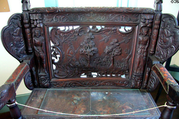 Carved back of English oak bench (1740) at 1749 Court House Museum. Plymouth, MA.