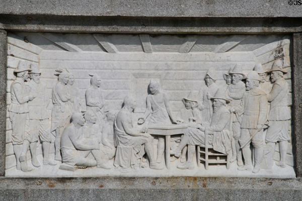 Relief carving of Pilgrims' Treaty with Native Americans on National Forefathers Monument. Plymouth, MA.