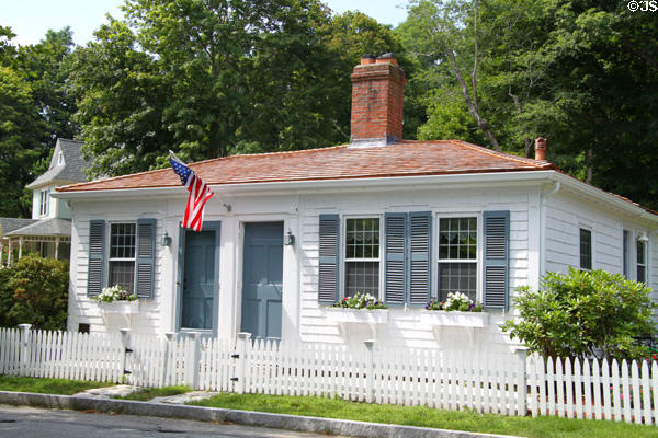 White double cottage with blue shutters (c1830) Grove St. near town square. Sandwich, MA.