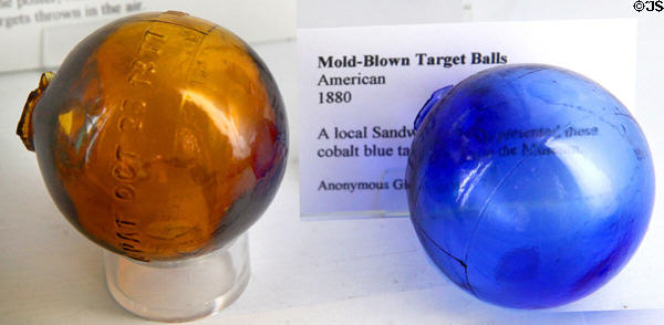 Mold-blown target balls (1880) of type used by Buffalo Bill Cody & Annie Oakley were filled with confetti to be better seen when shot at Sandwich Glass Museum. Sandwich, MA.